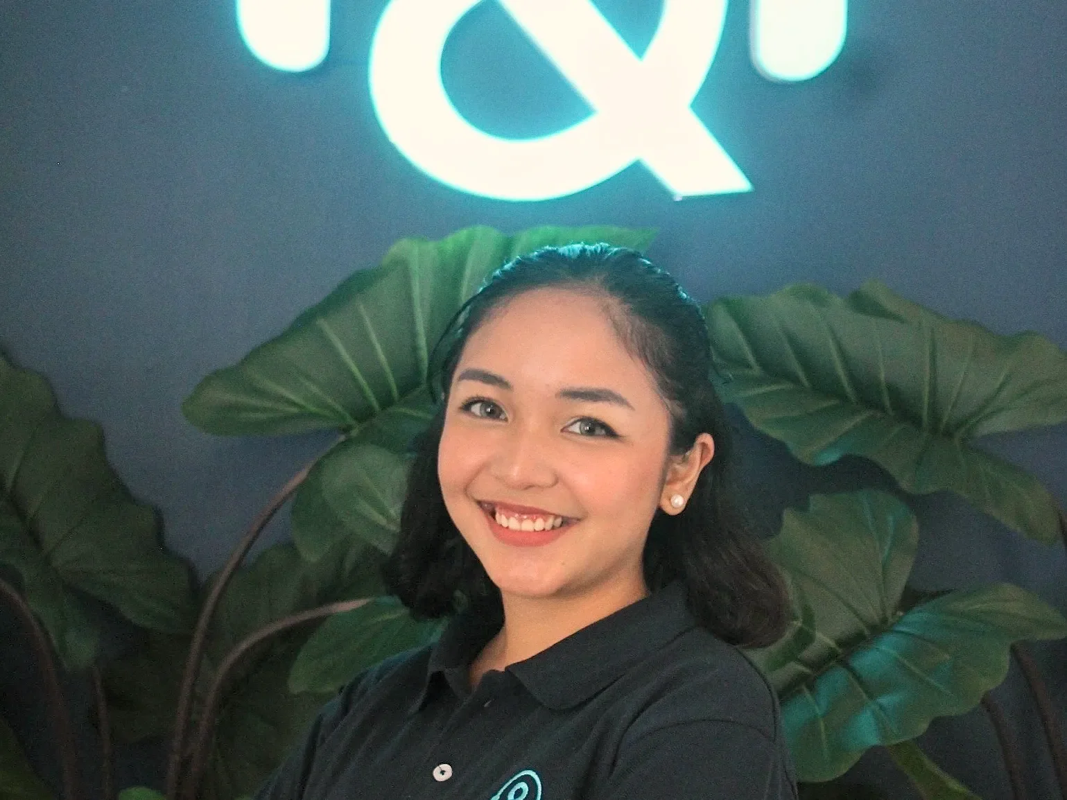 A smiling Desk & VA team member at the Downtown office